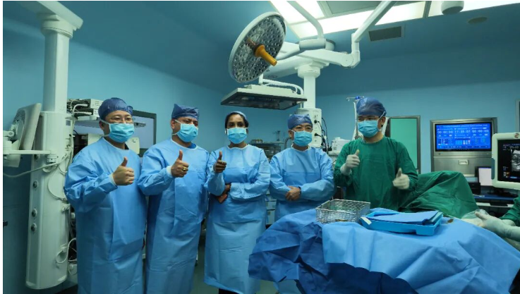 Clinical team observing a live minimally invasive procedure